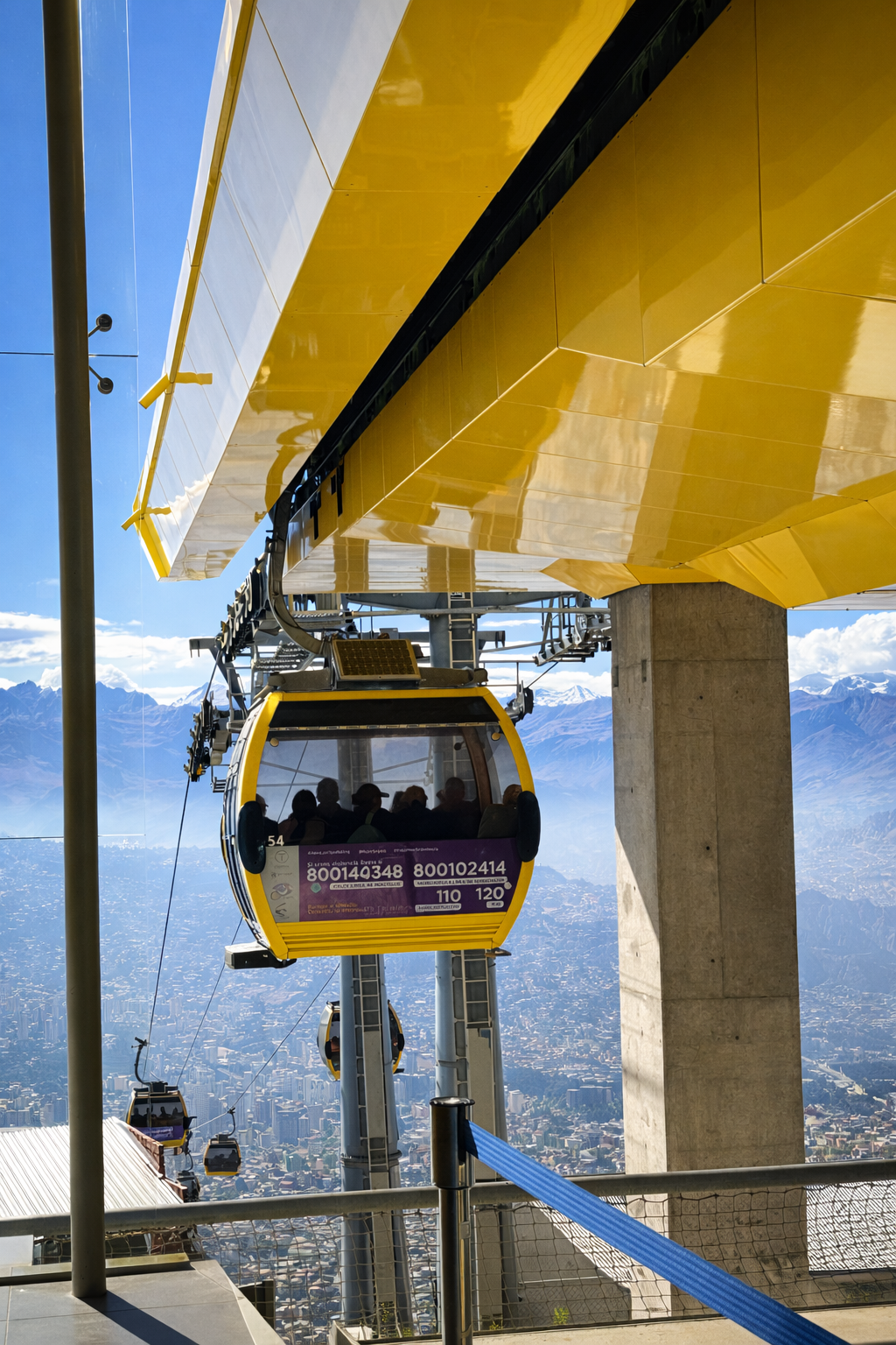 Yellow cable car line crossing over La Paz, Bolivia