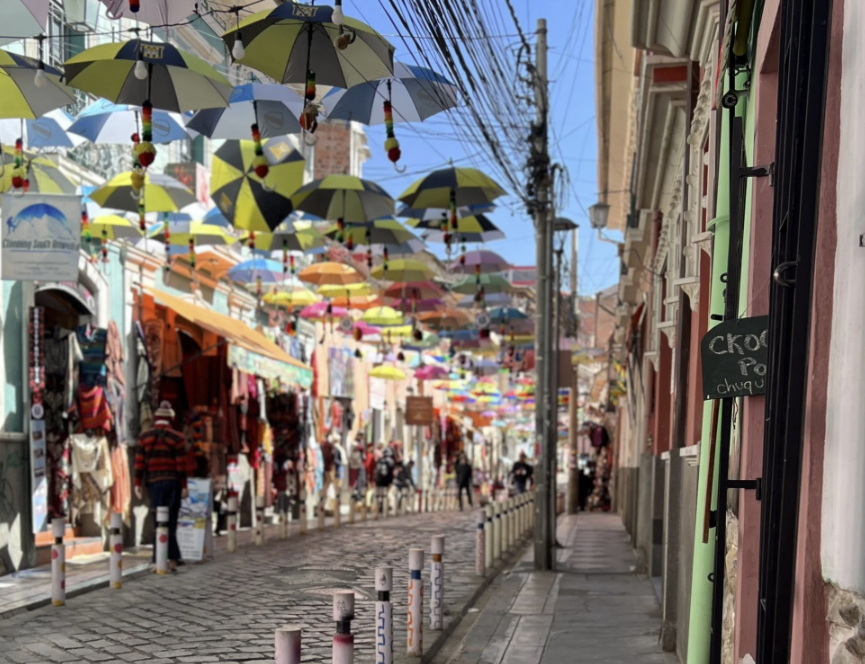 Umbrella Street in La Paz, colourful umbrellas hanging above the cobbled shopping lane