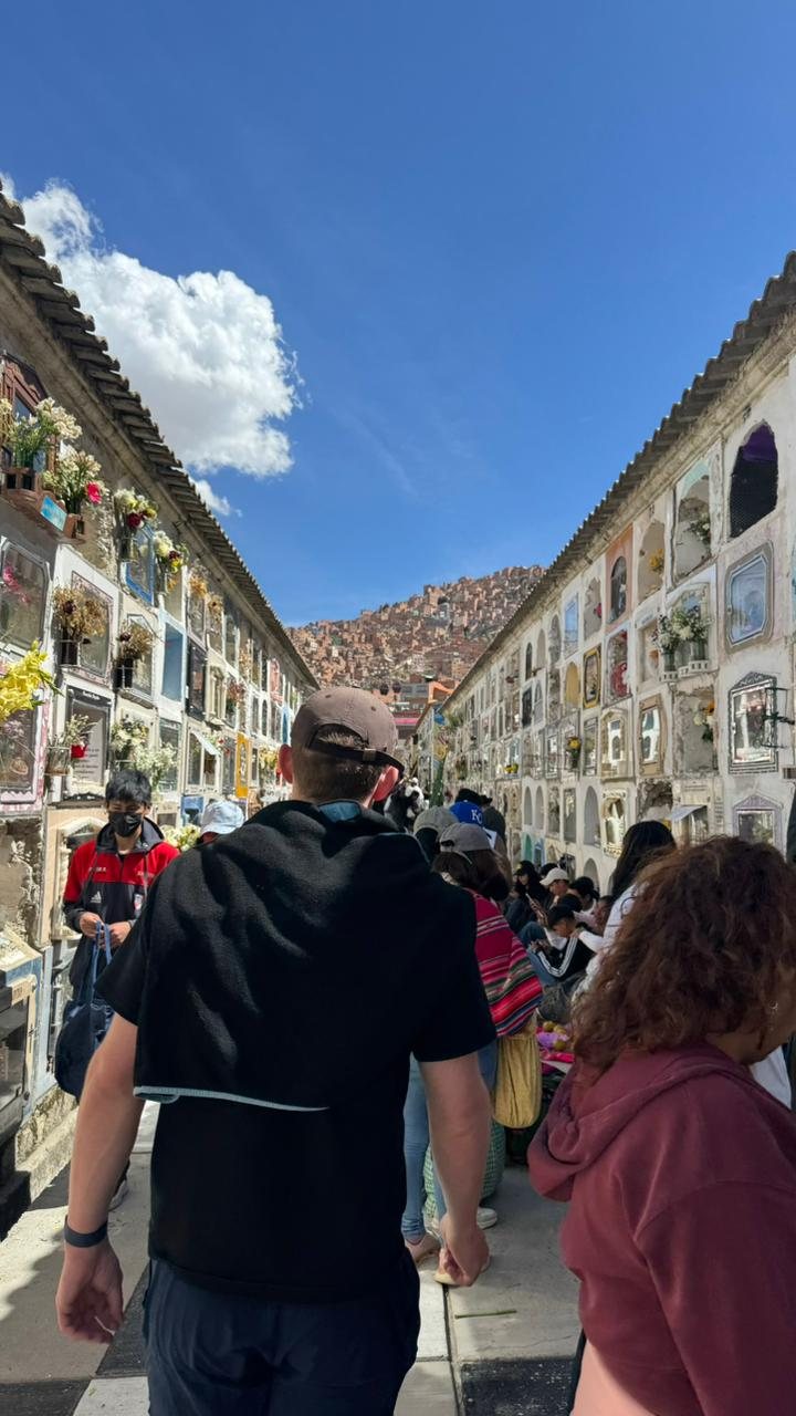 Walking between the long walls of niches at the Cementerio General on November 2