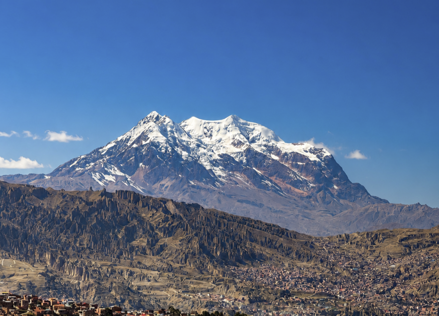 Snow-capped Illimani rising above the edge of La Paz on a clear winter morning
