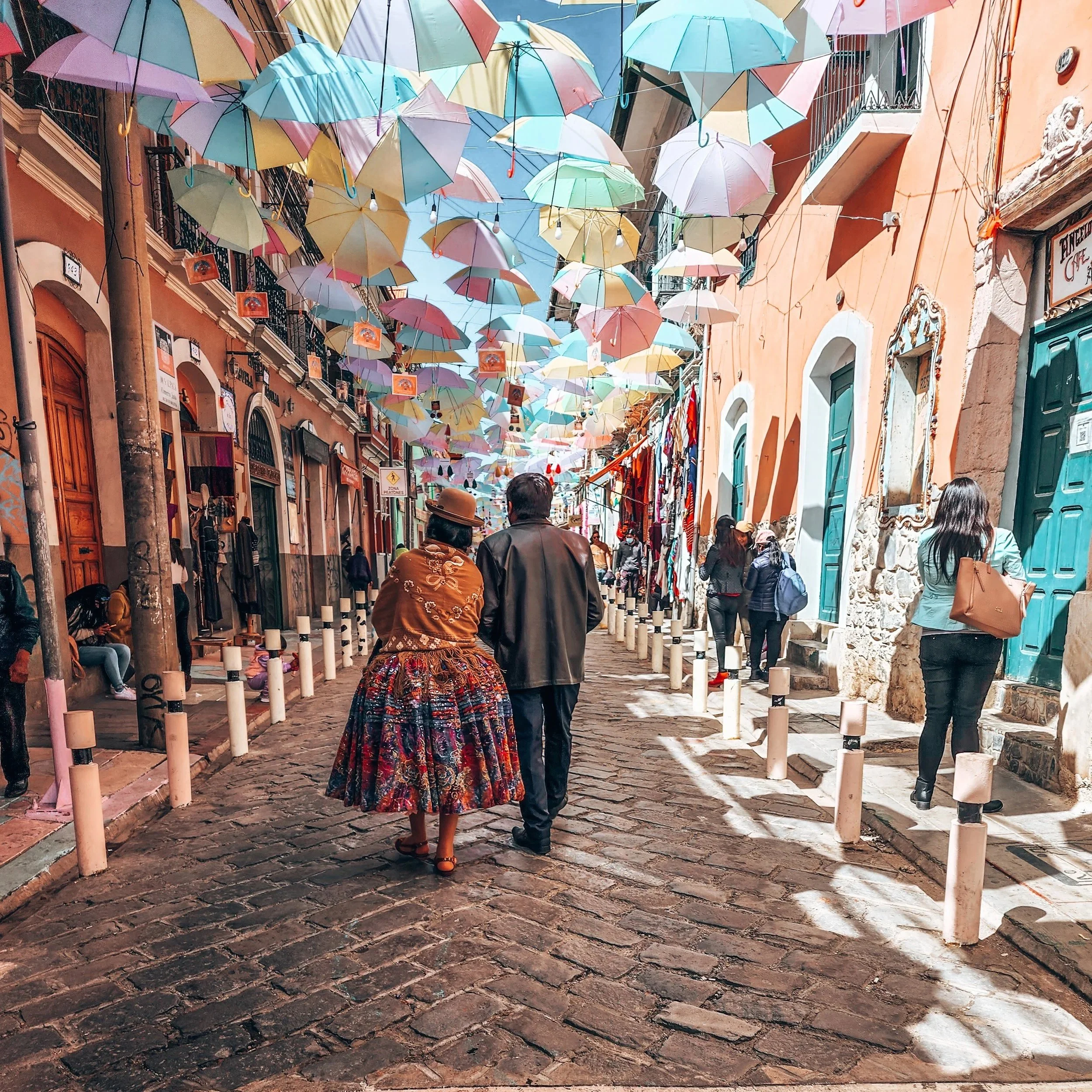 A busy street in the centre of La Paz near Sagárnaga, full of shops and market stalls
