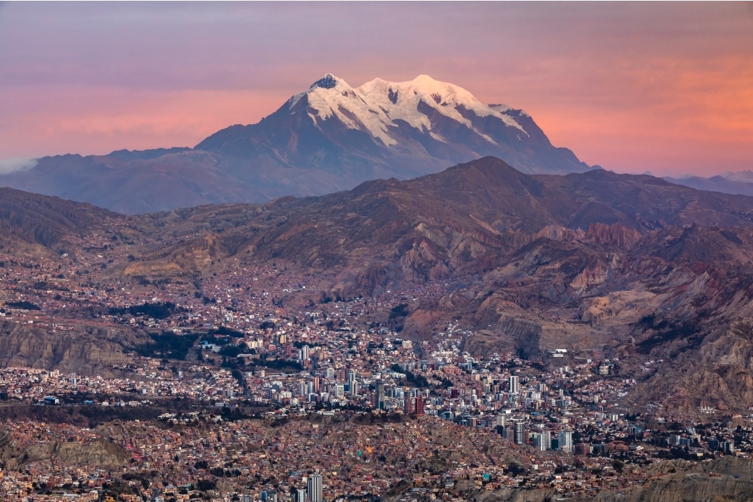 La Paz with the snow-capped Illimani mountain glowing at sunset