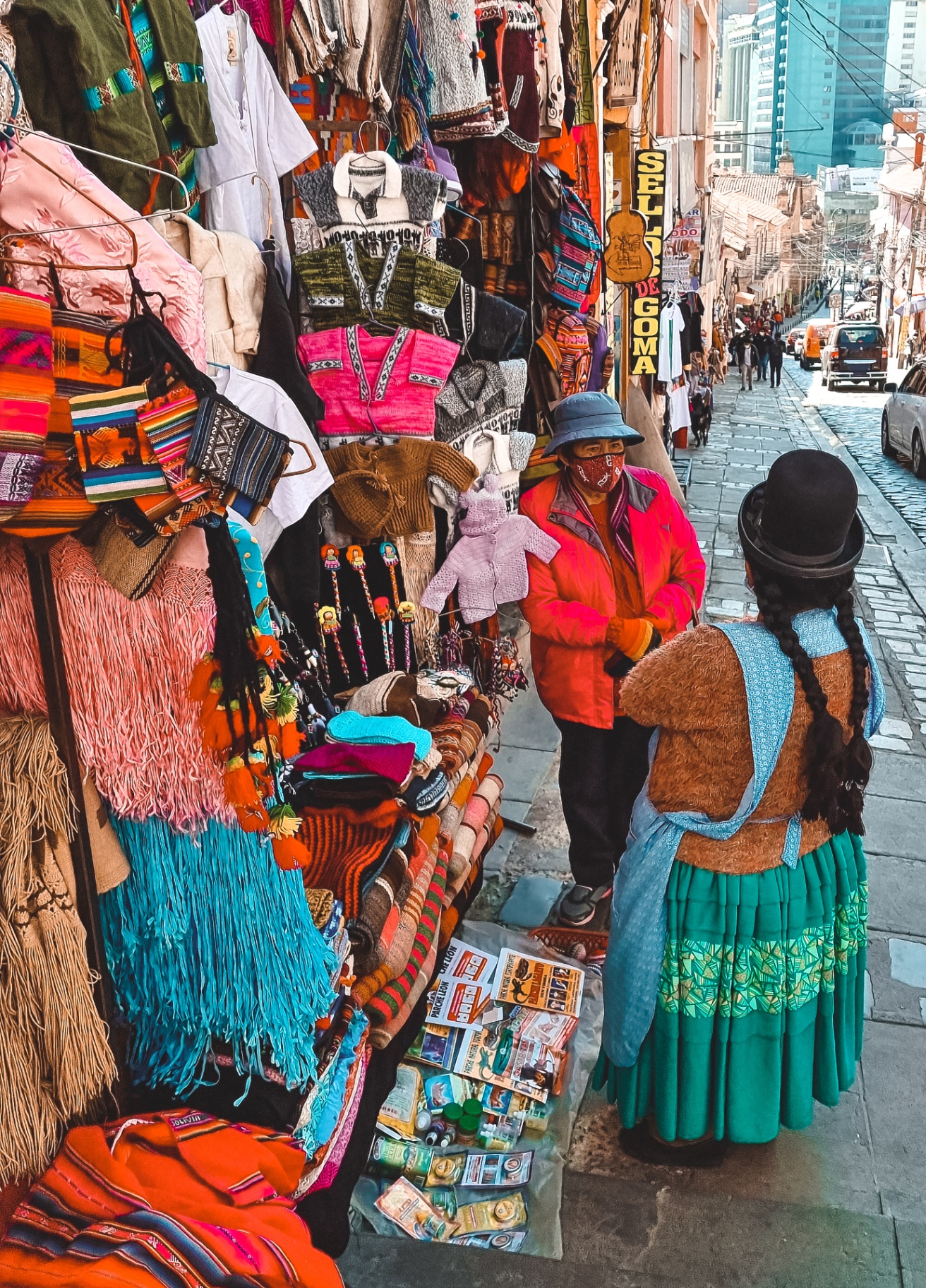 Colourful market stalls on a steep street near Sagárnaga in La Paz