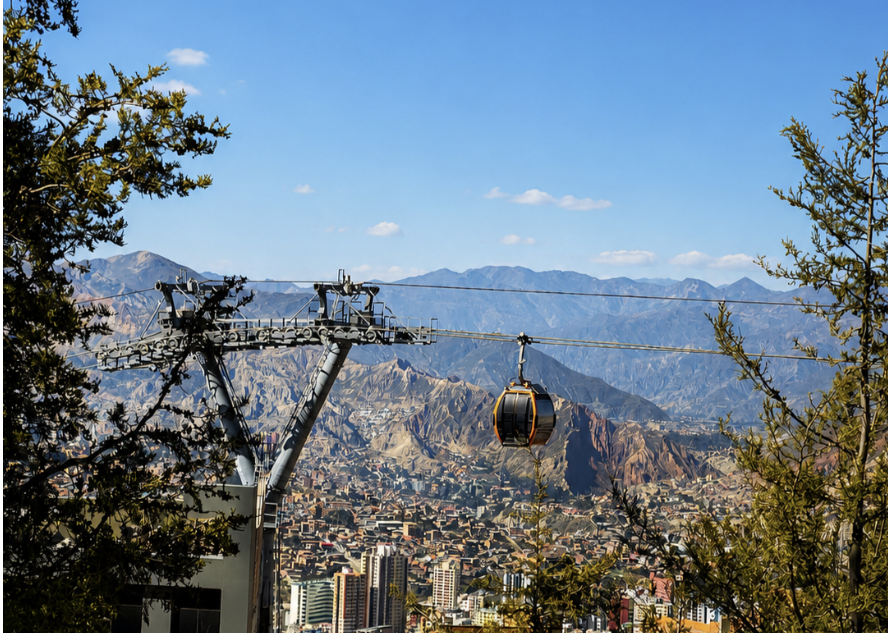 A cable car crossing above the hills and neighbourhoods of La Paz