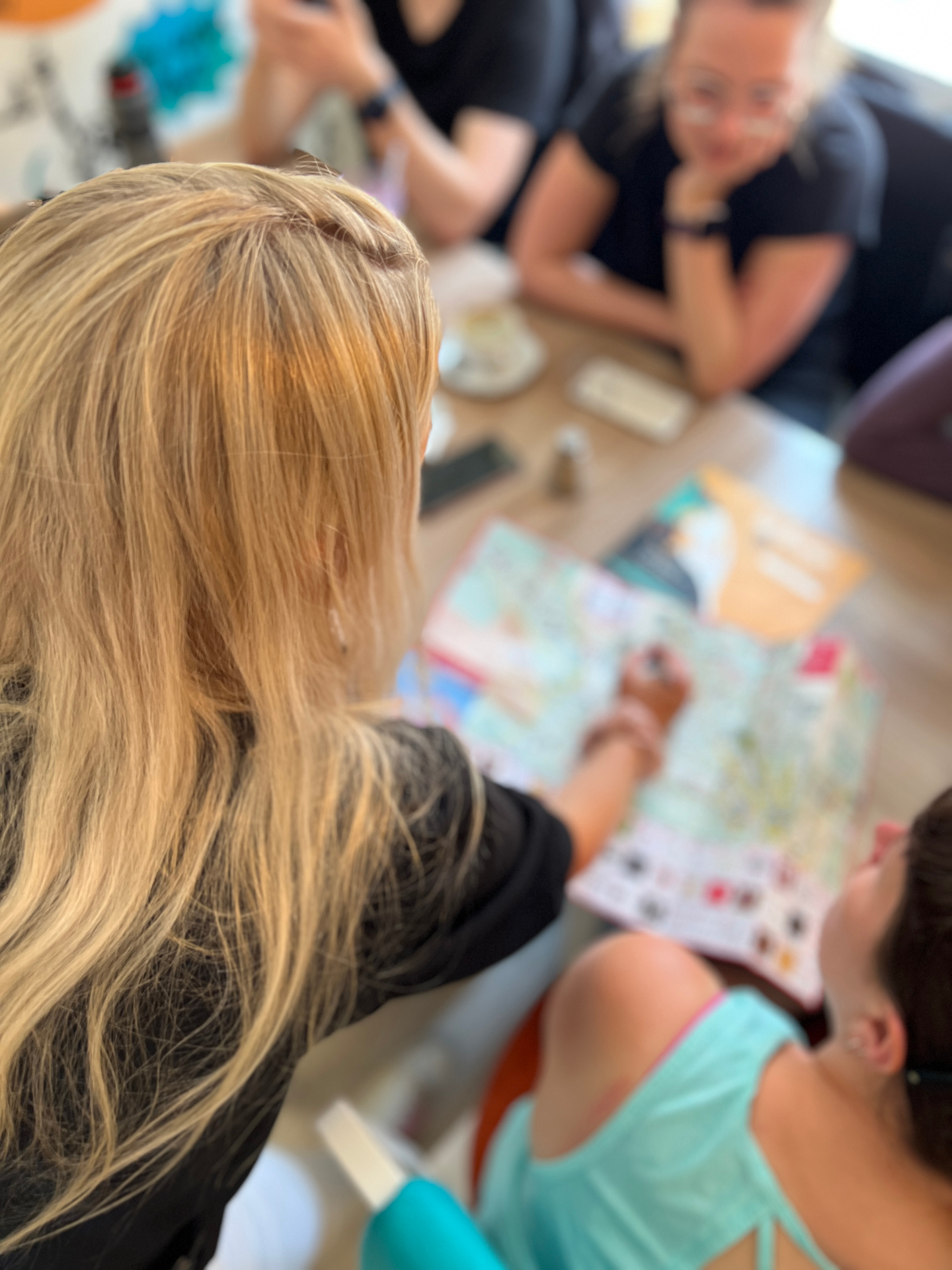 Travelers planning their first day over a map of La Paz at Café del Mundo